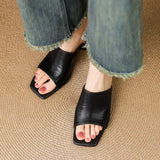 Odile | Mules med skulptural klack