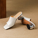 Odile | Mules med skulptural klack