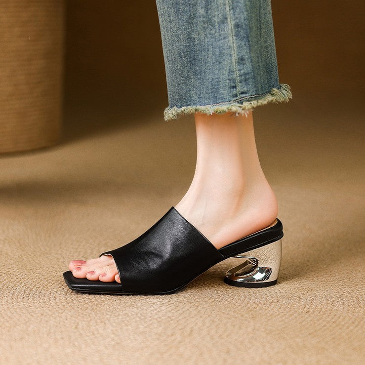 Odile | Mules med skulptural klack