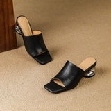 Odile | Mules med skulptural klack