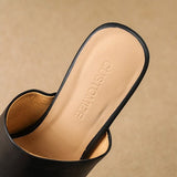 Odile | Mules med skulptural klack