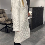 Produktbild – Kynzi – Elegant Vadderad Kappa