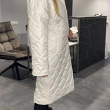 Produktbild – Kynzi – Elegant Vadderad Kappa
